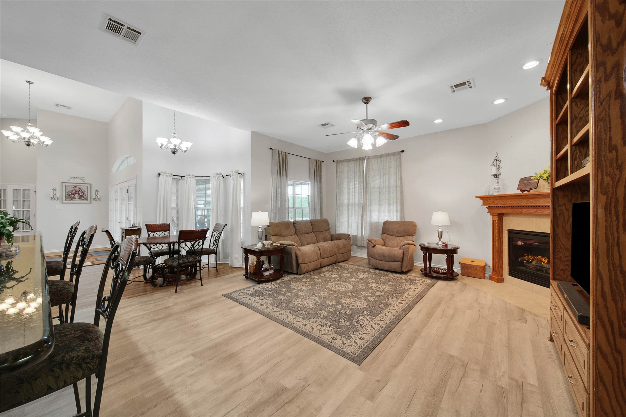 128 Duke Road Bedias, TX 77831 - Photo 14 of 50 a living room with furniture a fireplace and potted plants