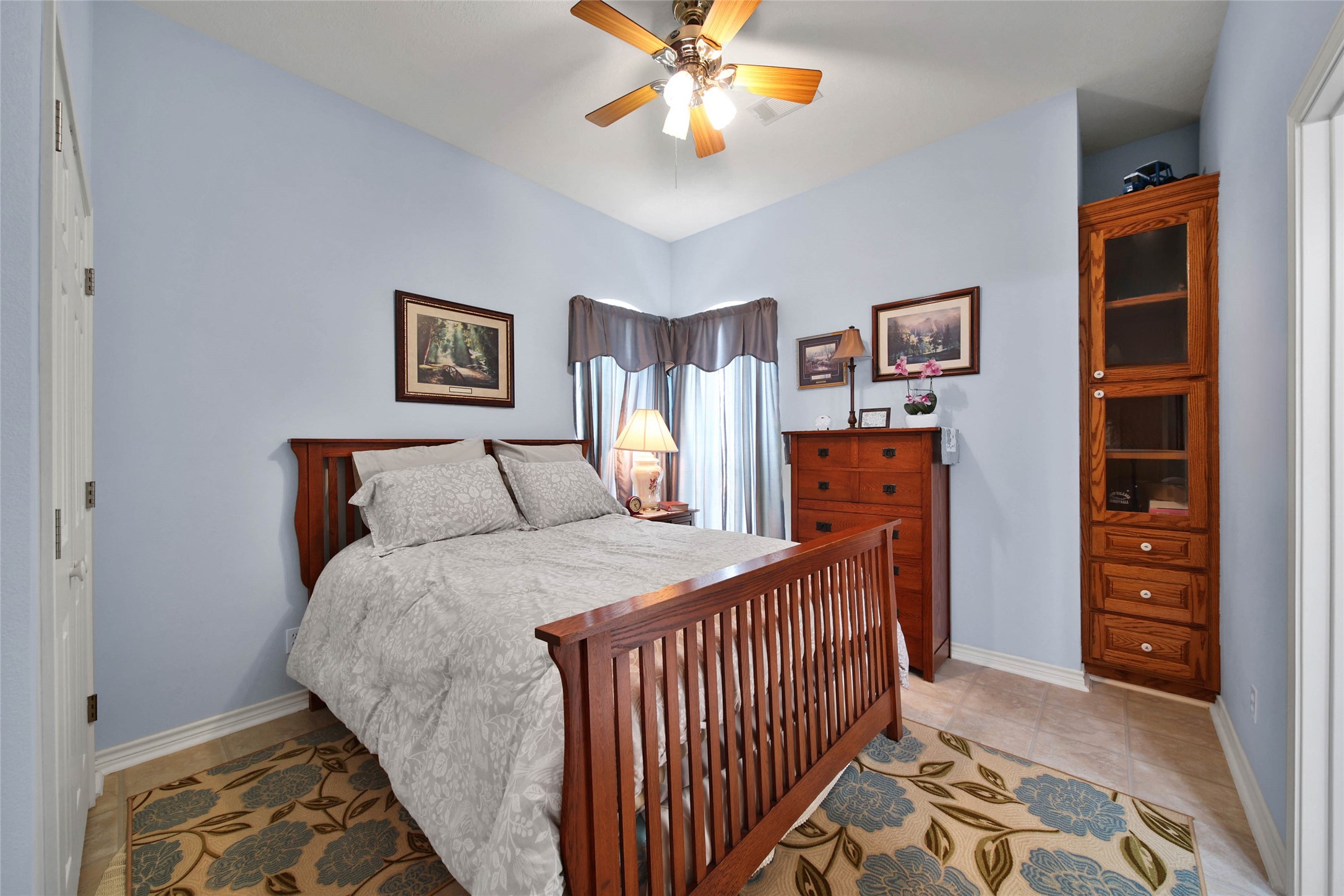 128 Duke Road Bedias, TX 77831 - Photo 23 of 50 a bedroom with bed and cabinets