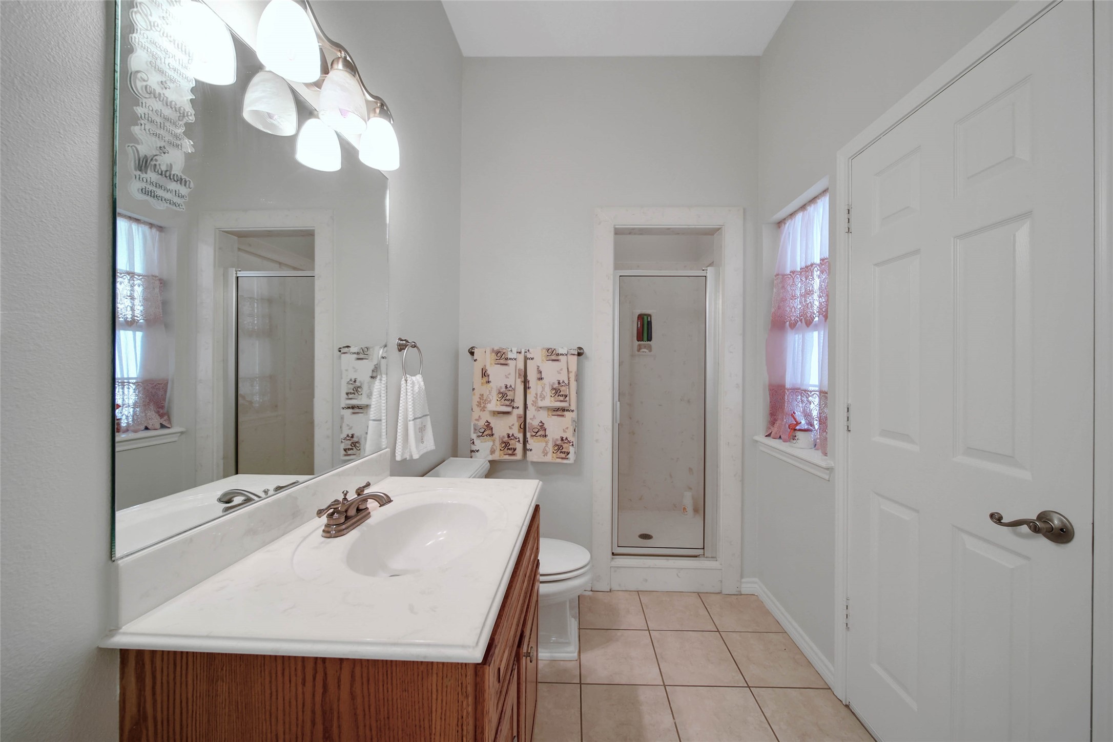 128 Duke Road Bedias, TX 77831 - Photo 27 of 50 a bathroom with a sink vanity and a mirror