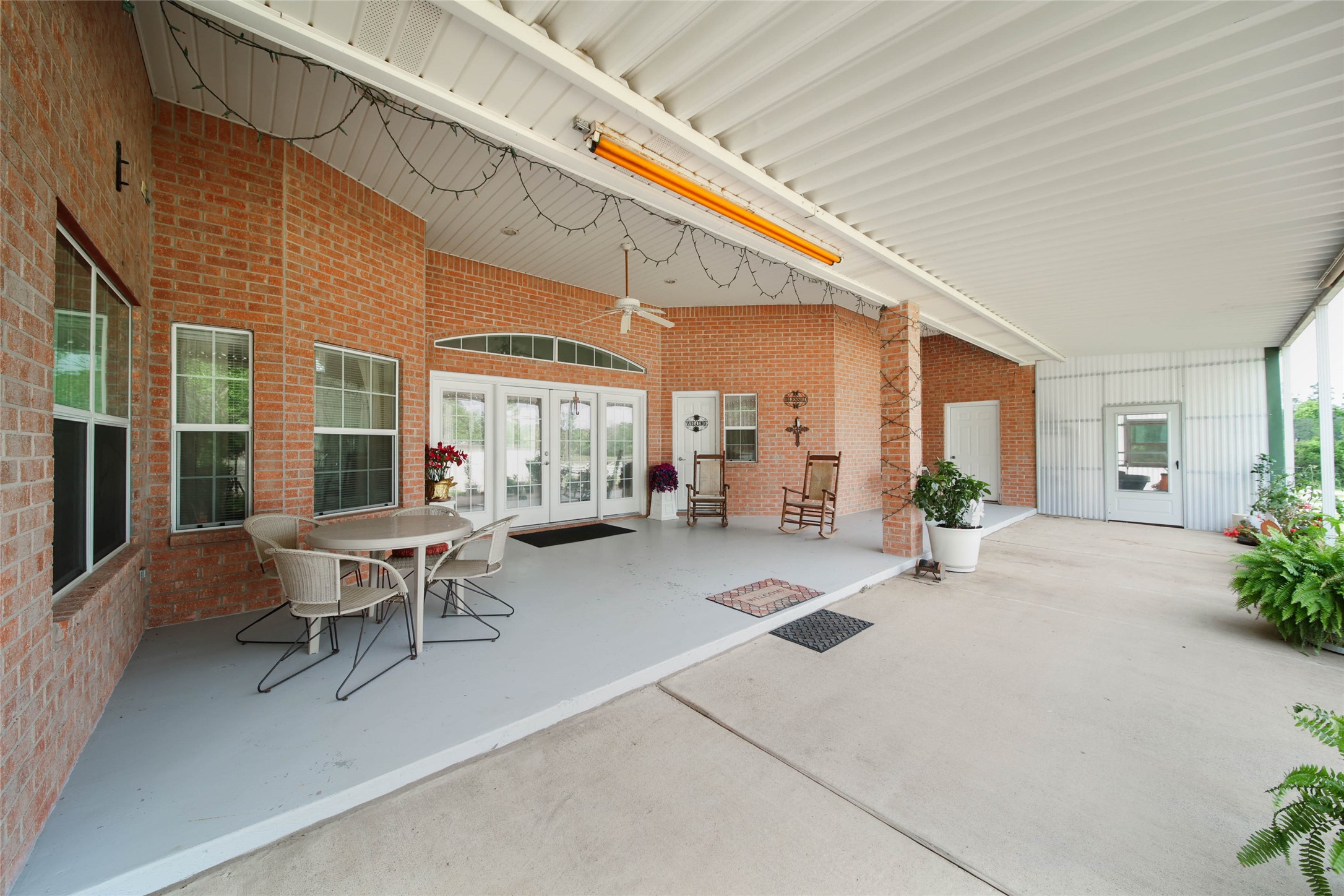 128 Duke Road Bedias, TX 77831 - Photo 34 of 50 a building outdoor space with patio furniture and potted plants