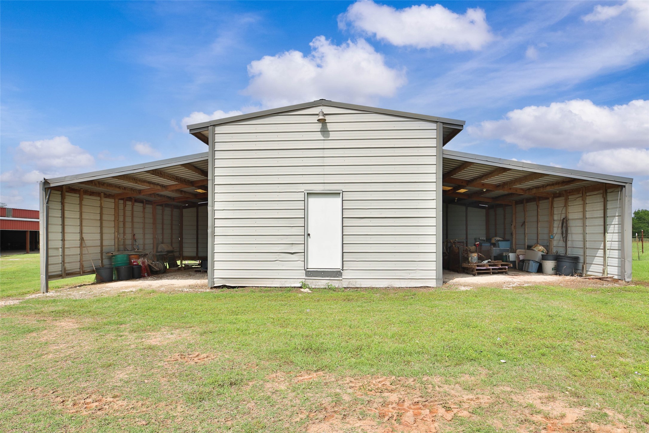 128 Duke Road Bedias, TX 77831 - Photo 45 of 50 a front view of a house with a yard and garage