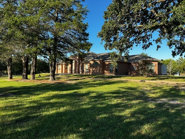 128 Duke Road Bedias, TX 77831 - Photo 5 of 50 a view of building with trees