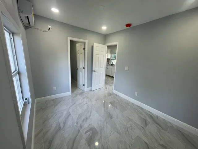 a view of hallway with wooden floor