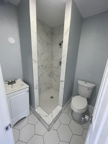 a bathroom with a sink a toilet and a bathtub