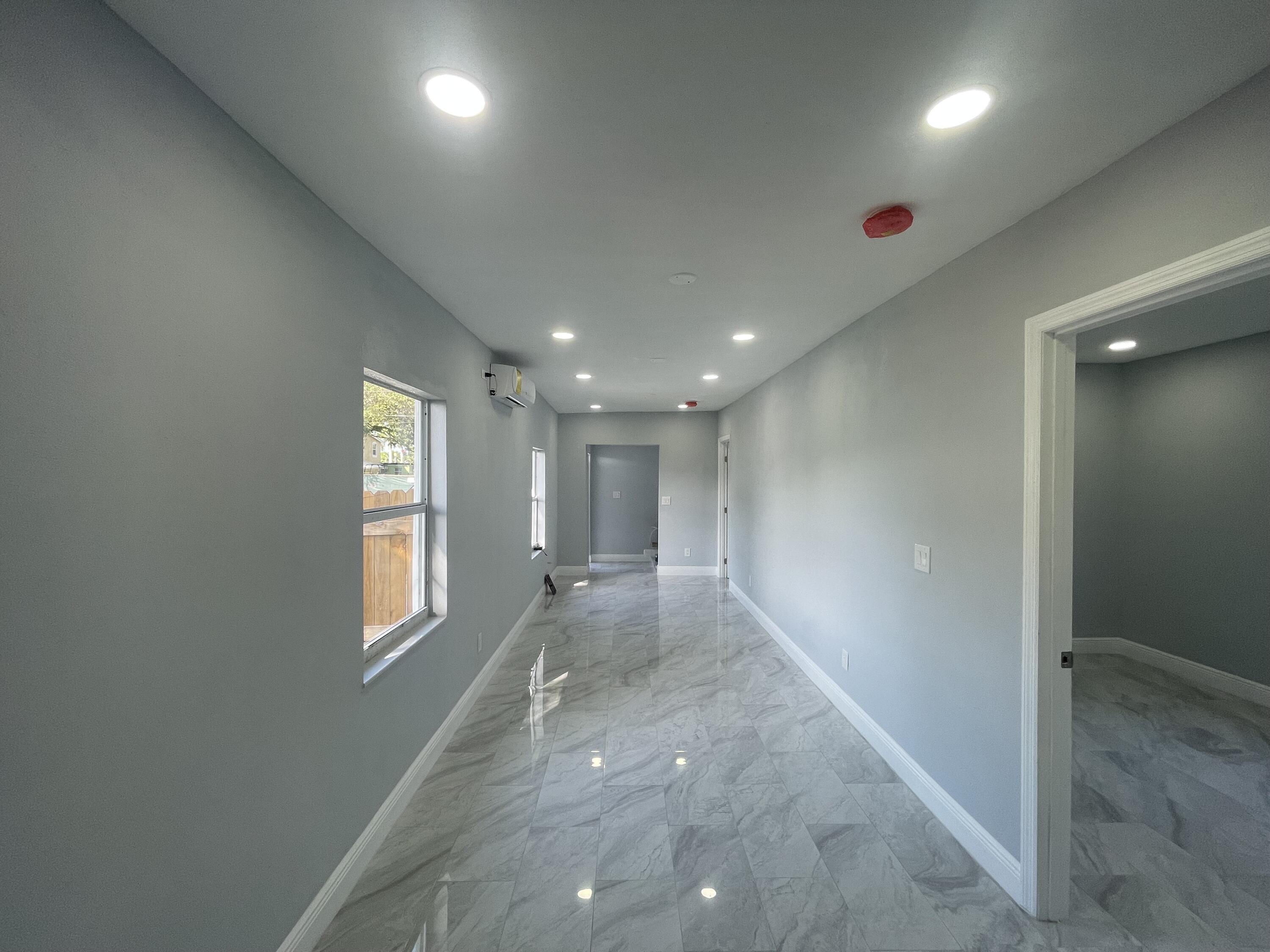 508 Means Court, Unit A Fort Pierce, FL 34950 - Photo 6 of 8 an empty room with windows and closet