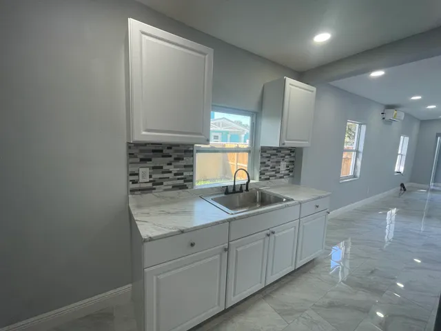 a kitchen with sink and window