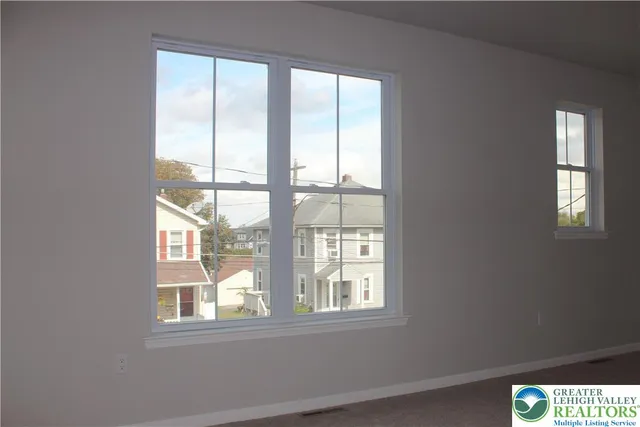 a view of an empty room with a window
