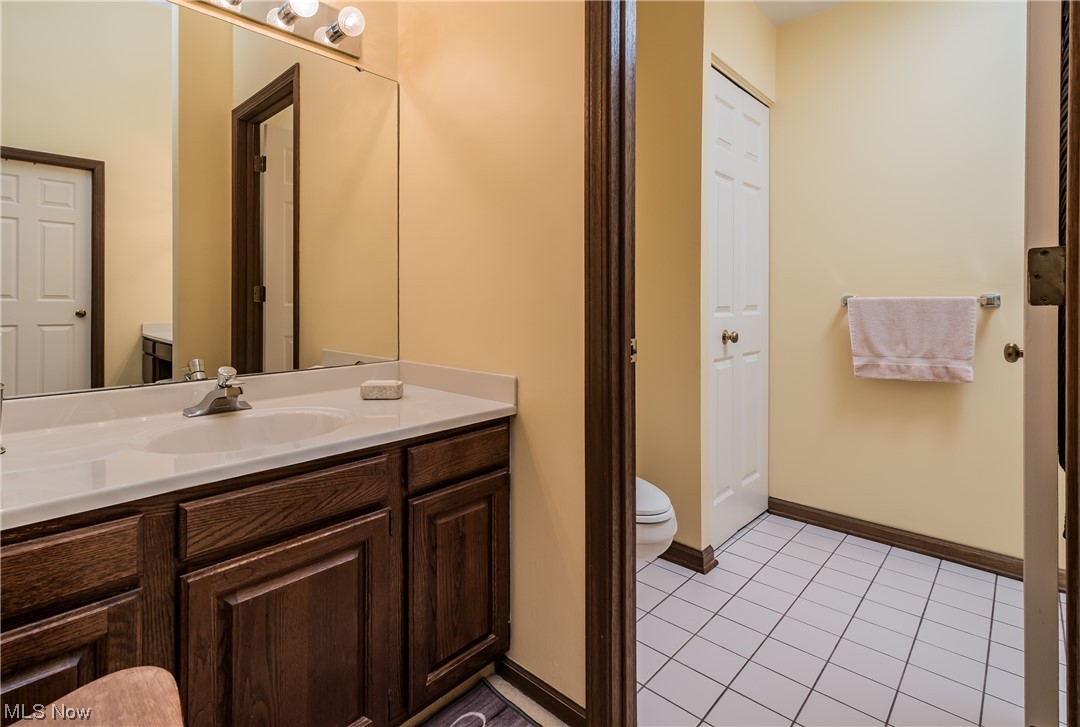 2879 Charing Cross Road Northwest Canton, OH 44708 - Photo 17 of 22 Bathroom with oversized vanity, tile floors, and toilet