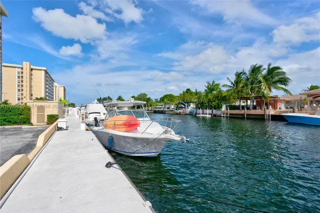 a view of swimming pool with outdoor seating and plants