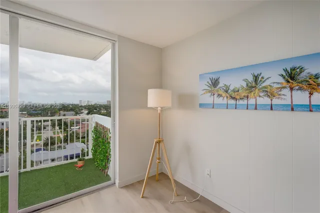a view of a living room and a floor to ceiling window
