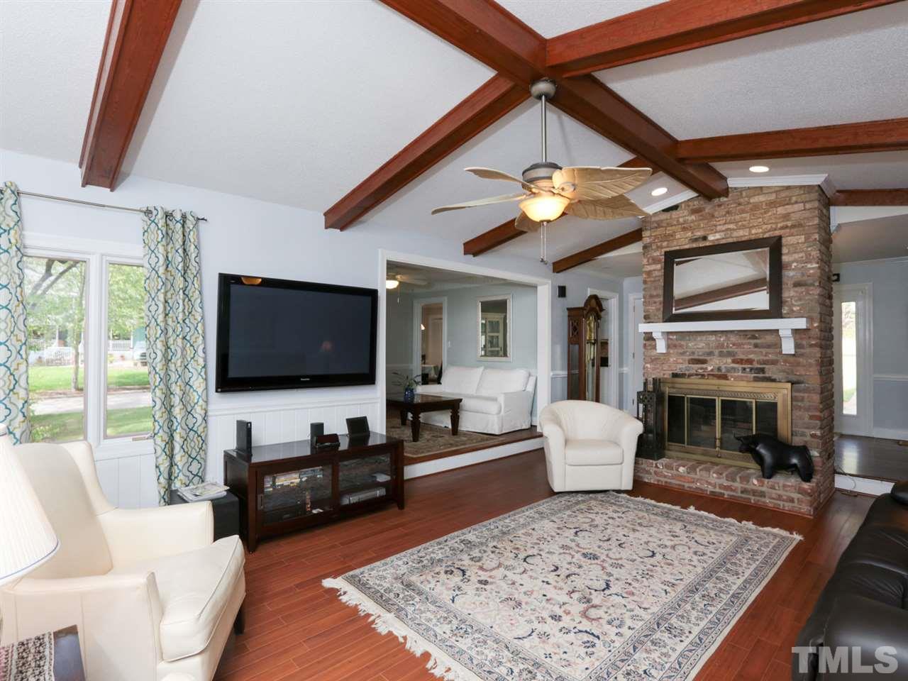 7309 Phellos Court Raleigh, NC 27615 - Photo 1 of 19 a living room with furniture and a flat screen tv