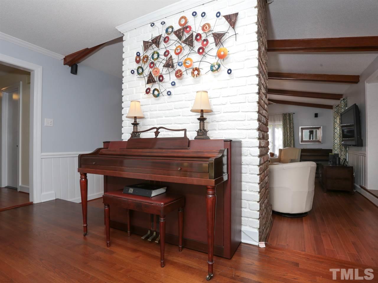 7309 Phellos Court Raleigh, NC 27615 - Photo 3 of 19 a living room with furniture and wooden floor