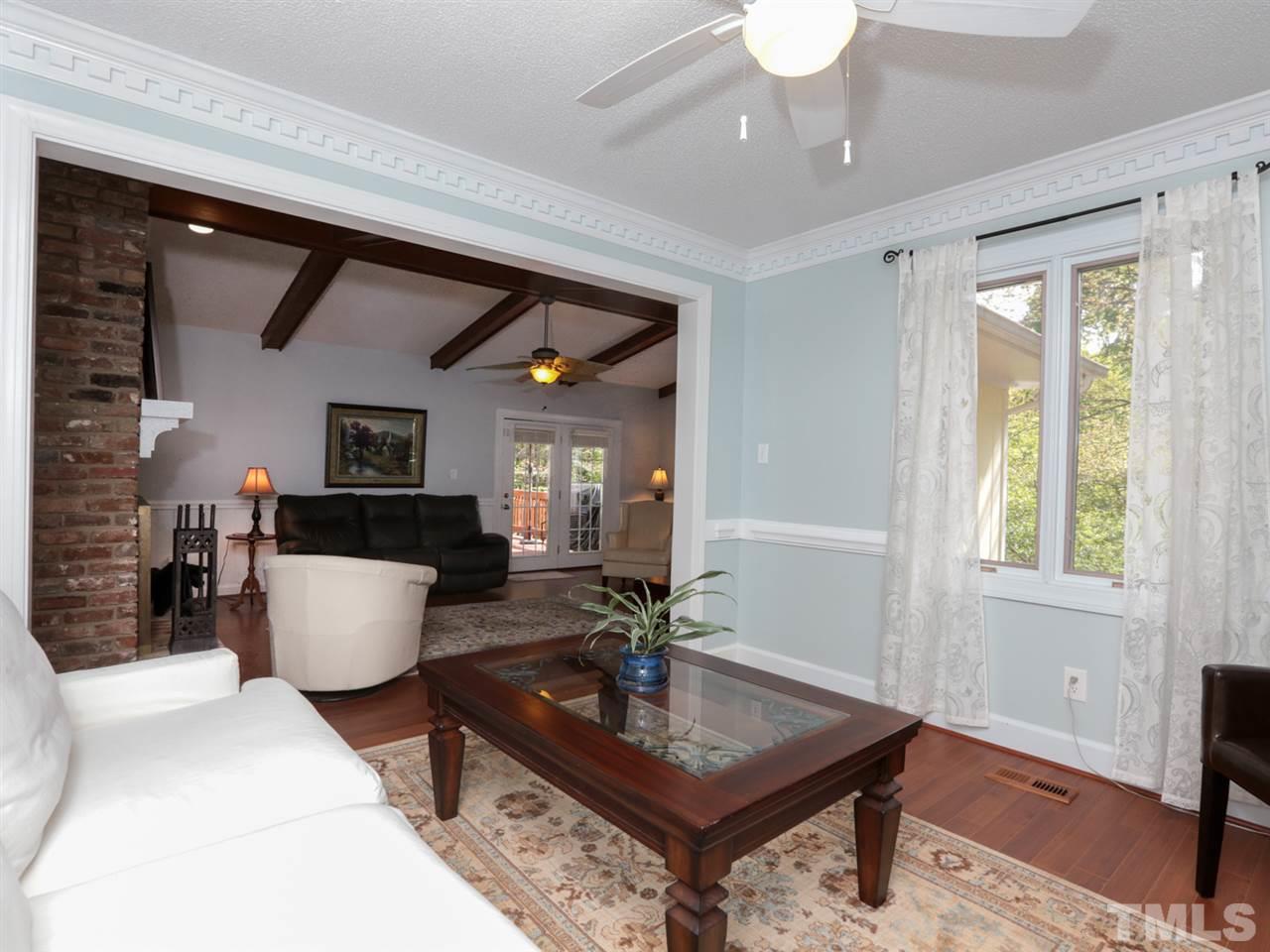 7309 Phellos Court Raleigh, NC 27615 - Photo 5 of 19 a living room with furniture a window and a dining table