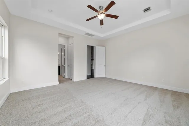 a bathroom with a bathtub sink mirror and toilet