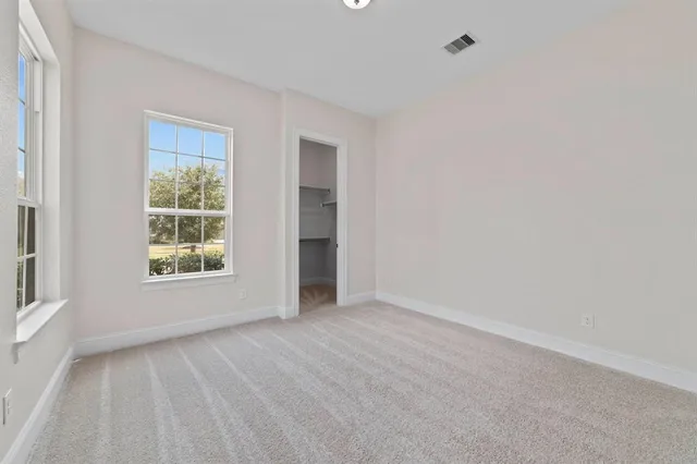 a bathroom with a sink a toilet and a large mirror