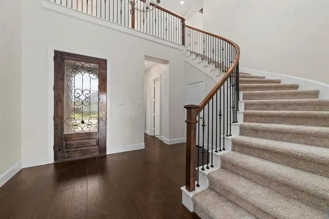 a view of entryway with wooden floor