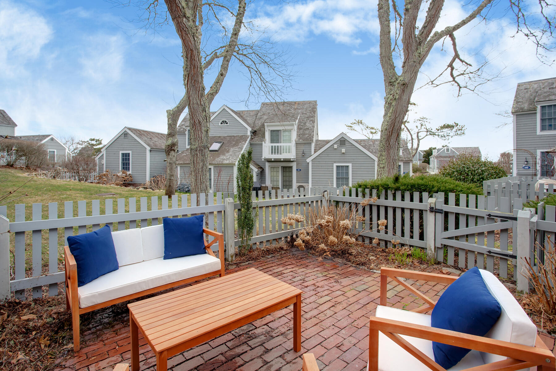 7 Flying Cloud Circle Mashpee, MA 02649 - Photo 18 of 23 a view of a chairs in patio of a house