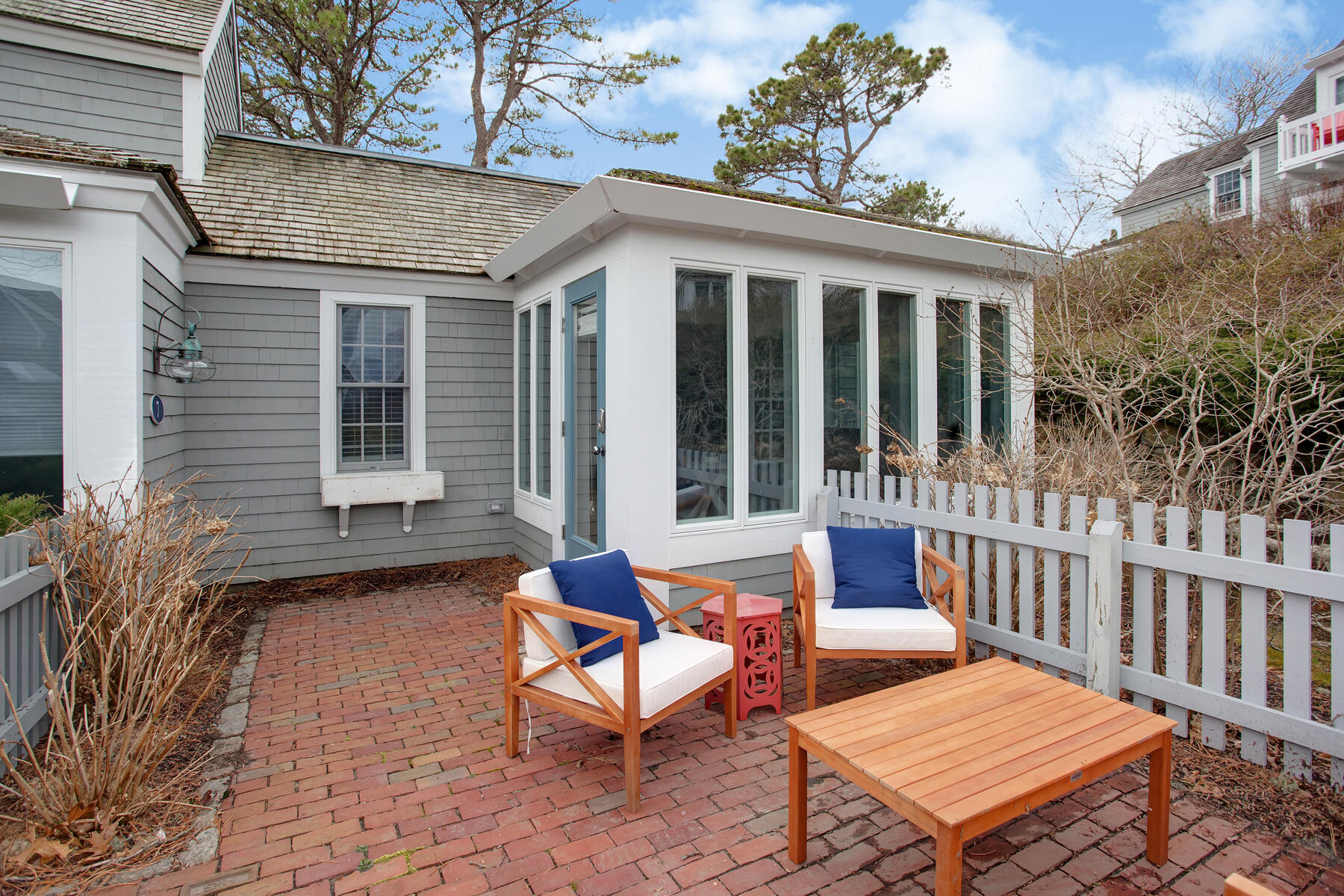 7 Flying Cloud Circle Mashpee, MA 02649 - Photo 19 of 23 a backyard of a house with table and chairs