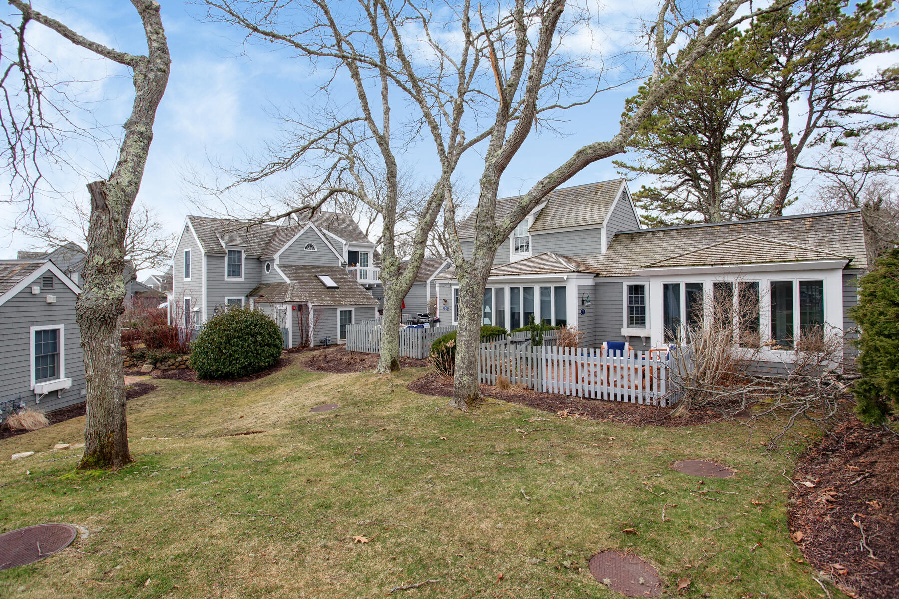 7 Flying Cloud Circle Mashpee, MA 02649 - Photo 20 of 23 a house that has a tree in front of it
