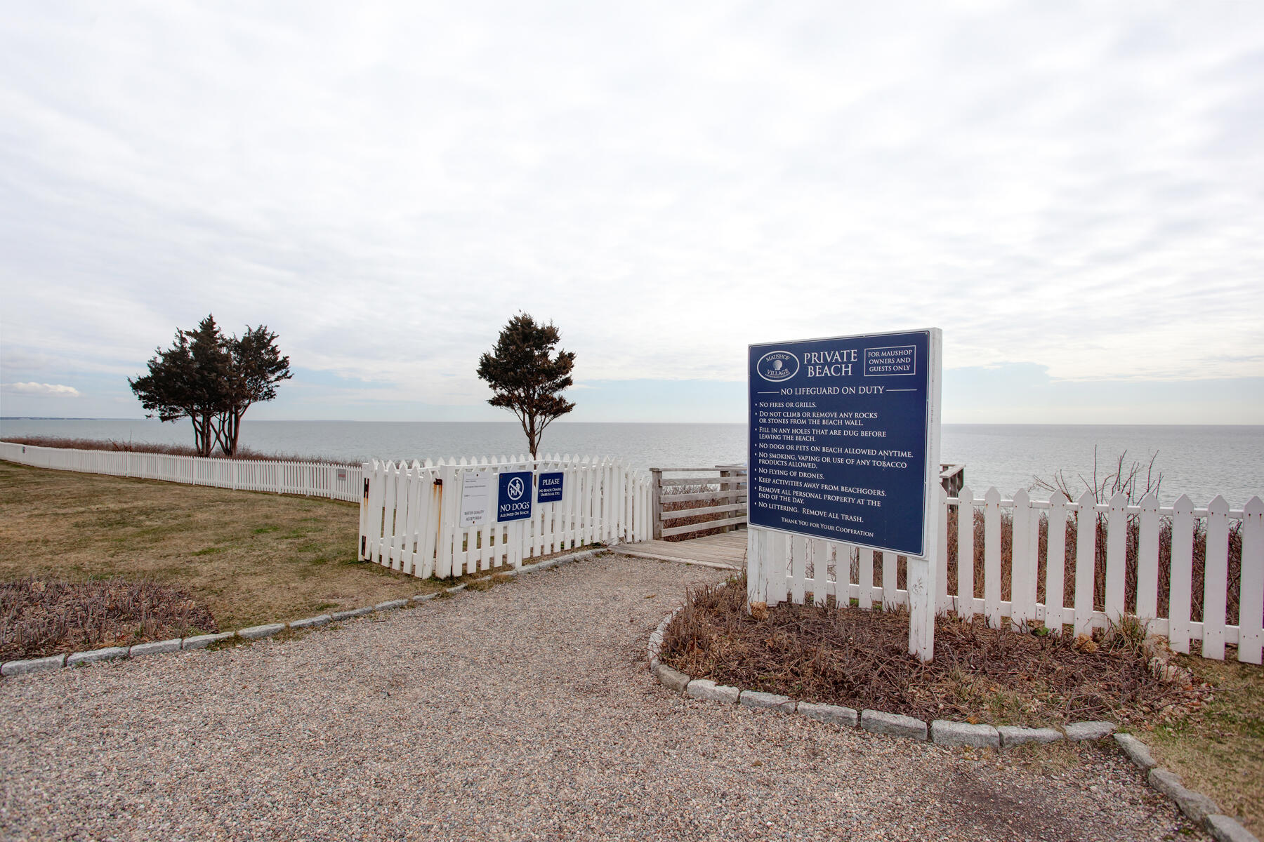 7 Flying Cloud Circle Mashpee, MA 02649 - Photo 21 of 23 a backyard of a house with a bench and wooden floor