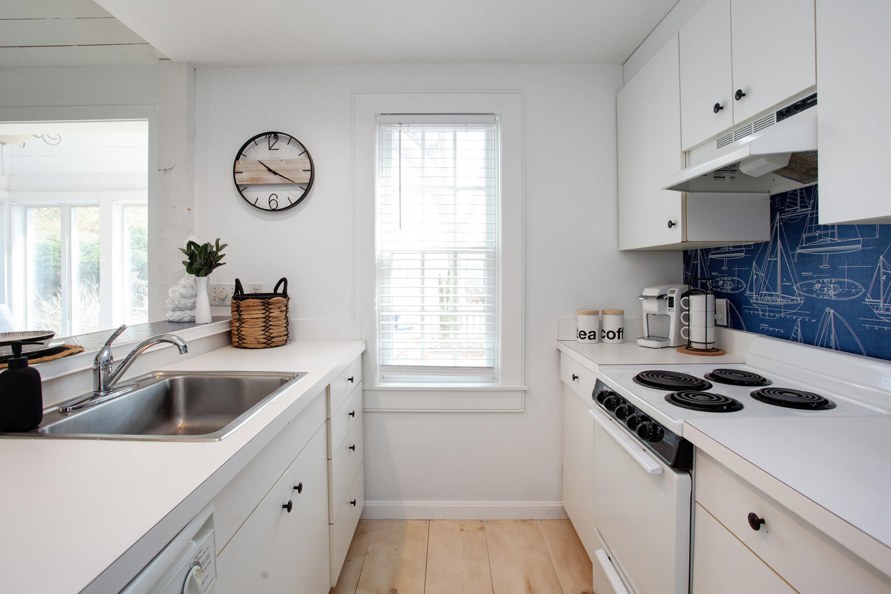 7 Flying Cloud Circle Mashpee, MA 02649 - Photo 8 of 23 a kitchen with a sink cabinets and window