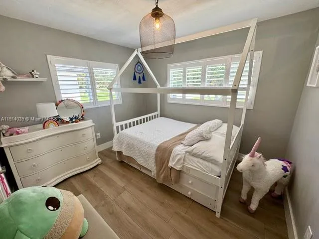 a bathroom with a sink double vanity granite and a toilet