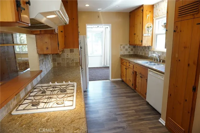 a view of a room with wooden floor and walls