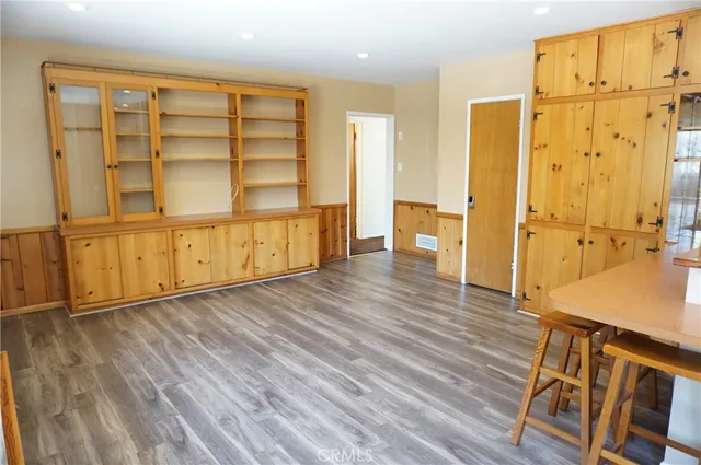 a view of livingroom with furniture window and front door