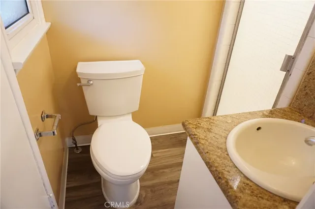 a bathroom with a sink and toilet