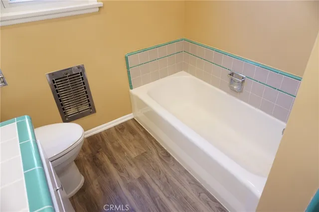 a outdoor space with patio the couches and a dining table with garden view