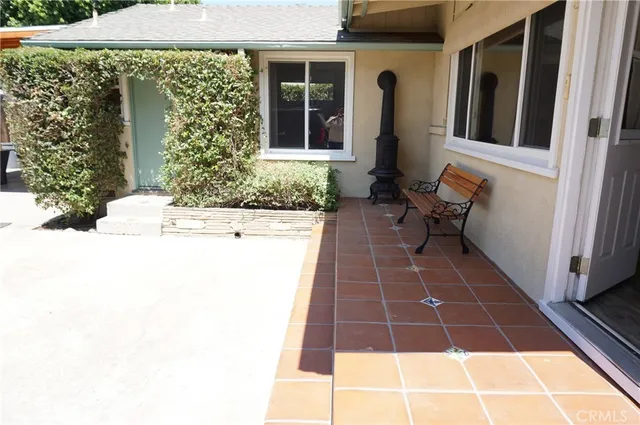 a view of a garden with a small house