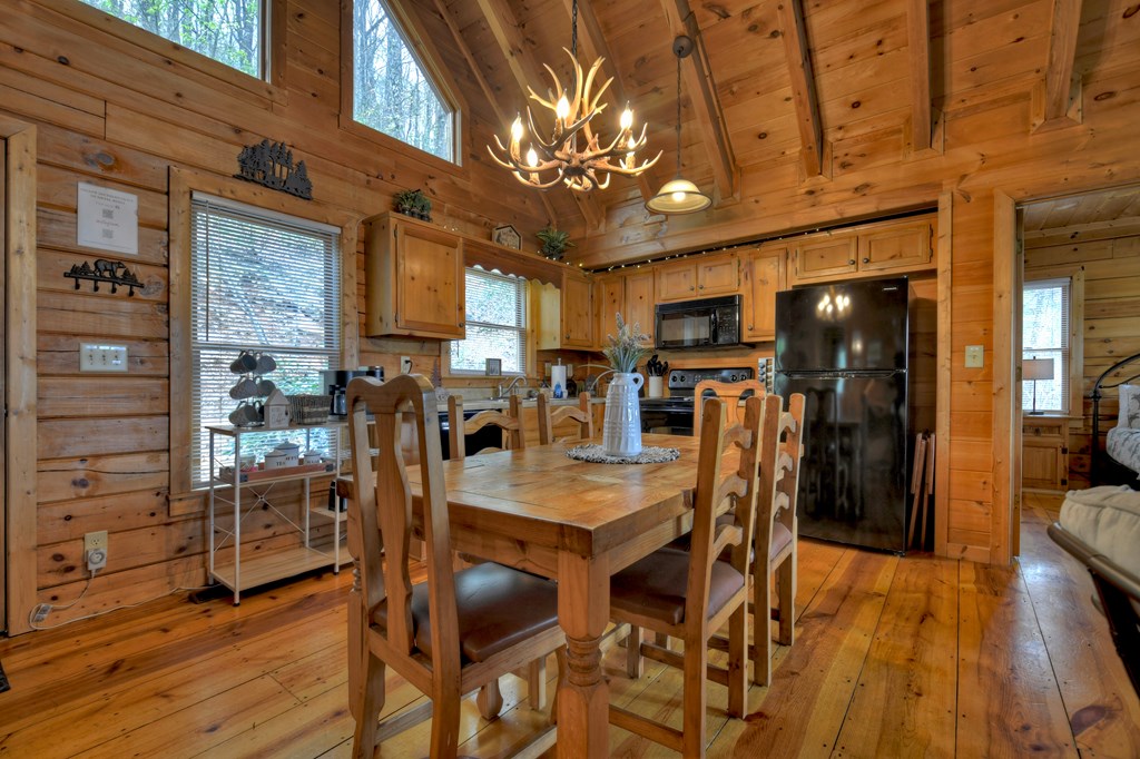 203 Chimney Rock Court Blue Ridge, GA 30513 - Photo 22 of 52 a view of a dining room with furniture window and wooden floor