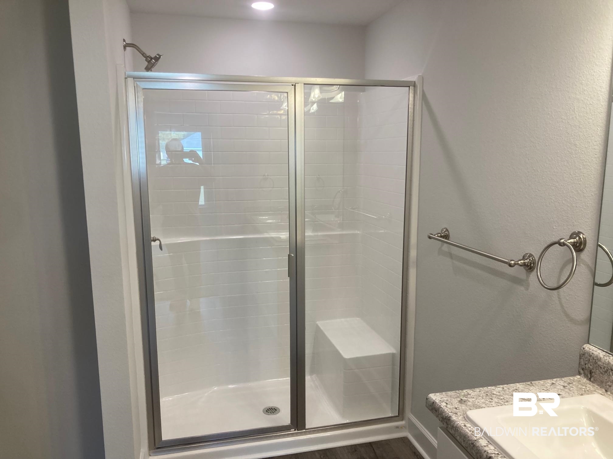 629 Revere Street Foley, AL 36535 - Photo 22 of 30 Bathroom featuring hardwood / wood-style floors, vanity, and walk in shower