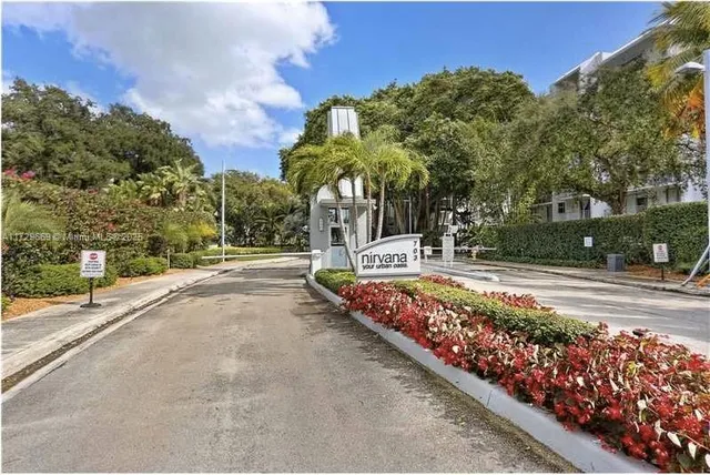 a view of beach with palm trees