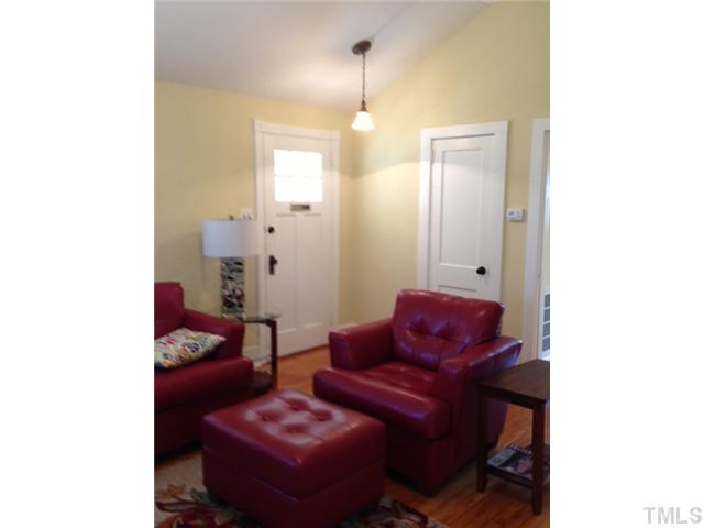 2310 Wade Avenue Raleigh, NC 27607 - Photo 3 of 14 a living room with furniture and a lamp