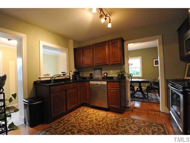 2310 Wade Avenue Raleigh, NC 27607 - Photo 7 of 14 a kitchen with a refrigerator and a stove