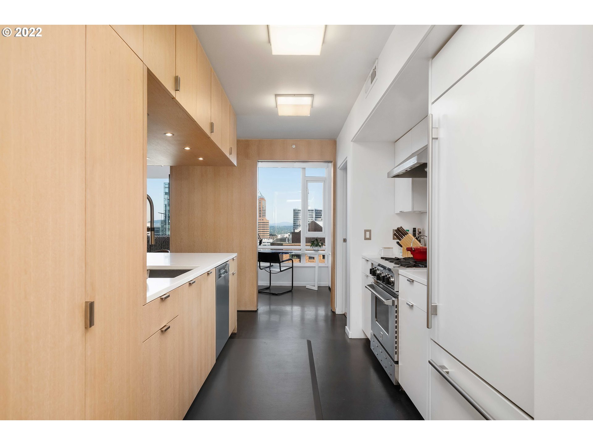 1500 Southwest 11th Avenue, Unit 1504 Portland, OR 97201 - Photo 19 of 32 a open kitchen with white cabinets and sink