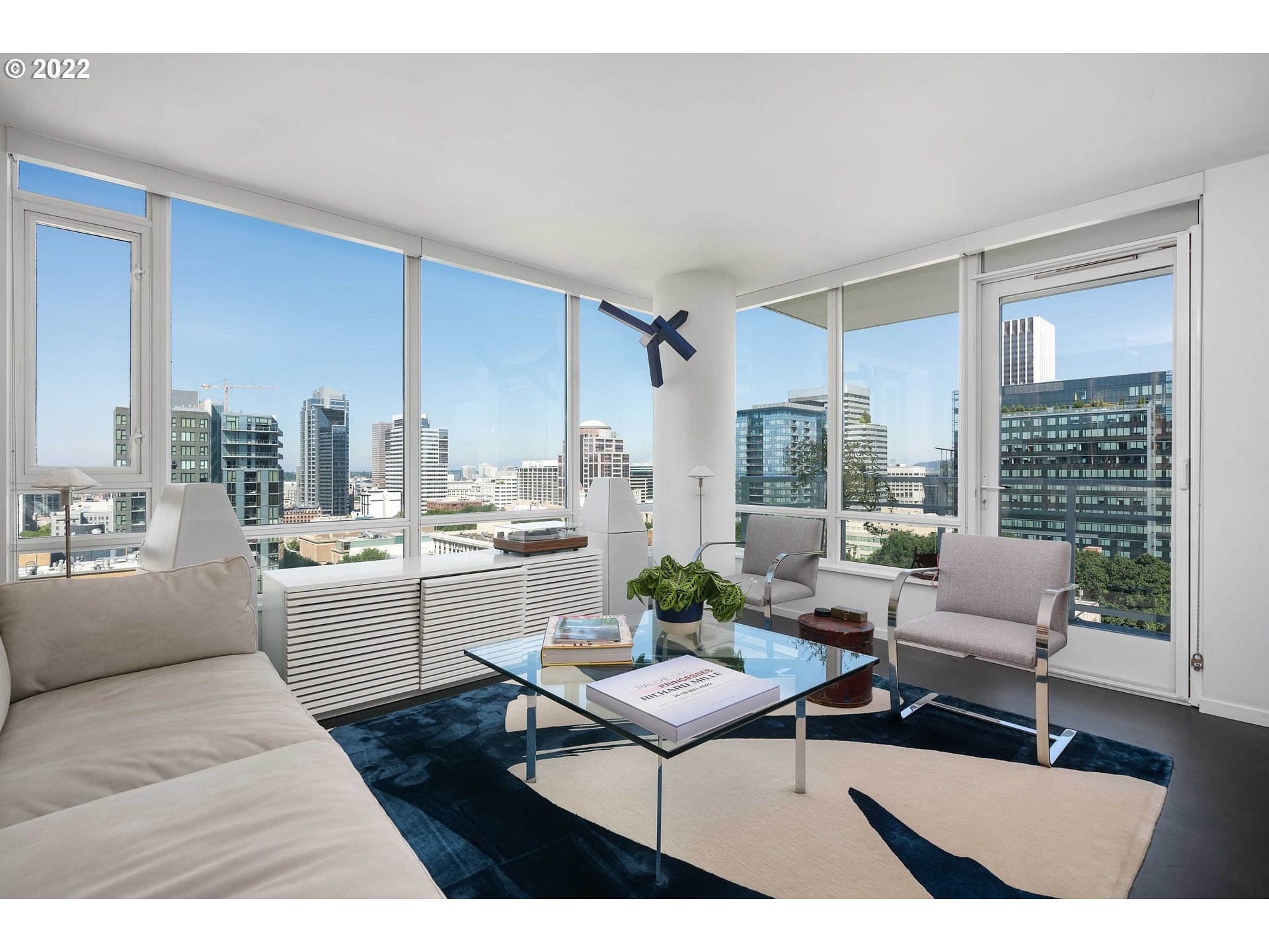 1500 Southwest 11th Avenue, Unit 1504 Portland, OR 97201 - Photo 5 of 32 a living room with furniture dining table and a large window
