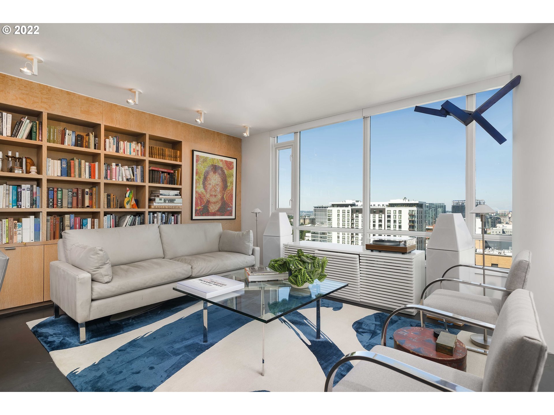 1500 Southwest 11th Avenue, Unit 1504 Portland, OR 97201 - Photo 7 of 32 a living room with furniture and a book shelf