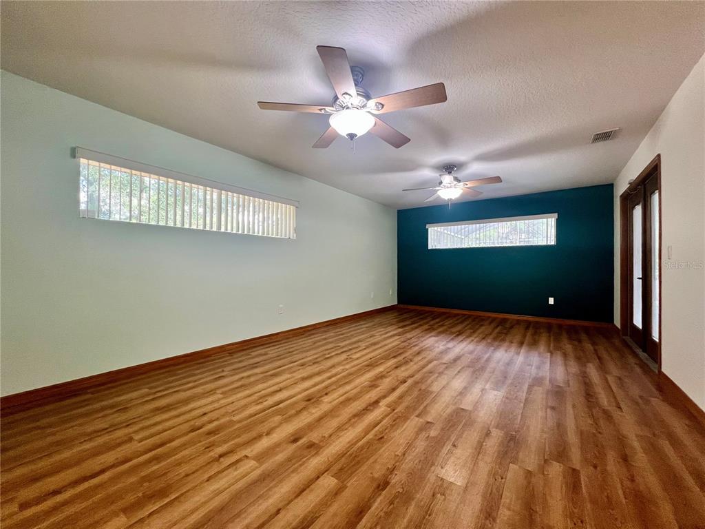 1156 South Carpenter Avenue Orange City, FL 32763 - Photo 11 of 21 a view of a livingroom with a ceiling fan and window