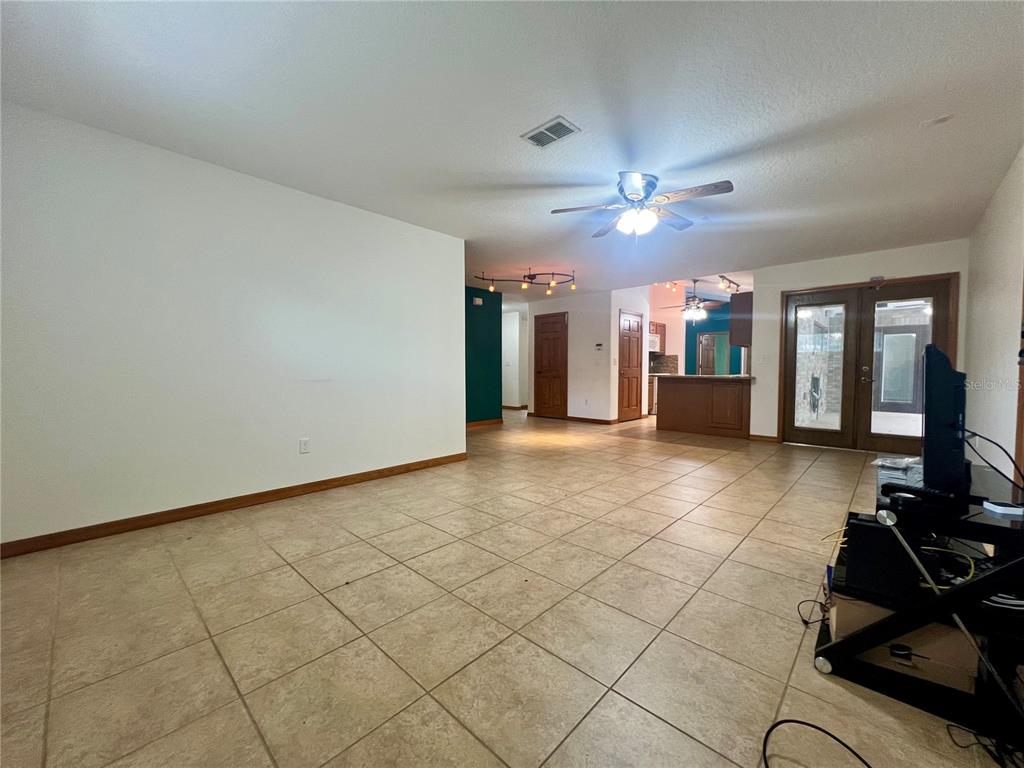 1156 South Carpenter Avenue Orange City, FL 32763 - Photo 6 of 21 a view of a room with gym equipment