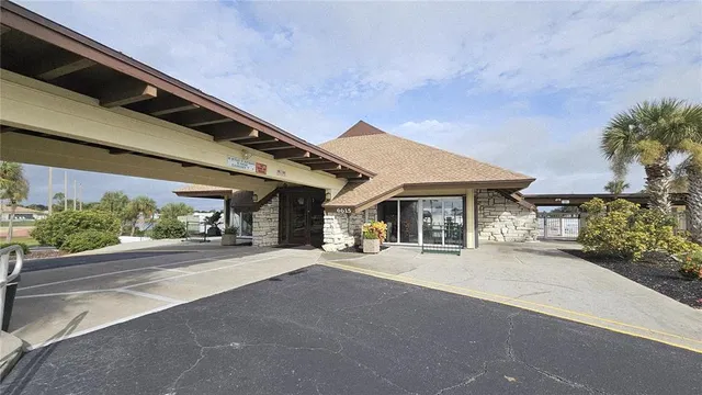 a view of a building with sitting area