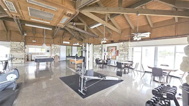 a view of a dining room with furniture water view and chandelier