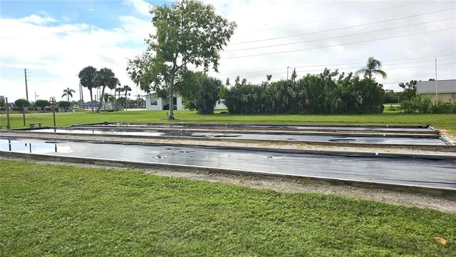 a view of a swimming pool and a yard