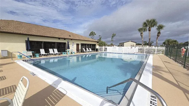 a view of a swimming pool with a patio