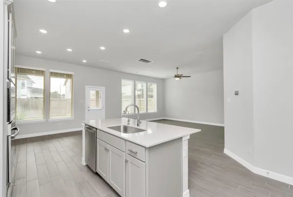 a bathroom with a sink double vanity and a tub