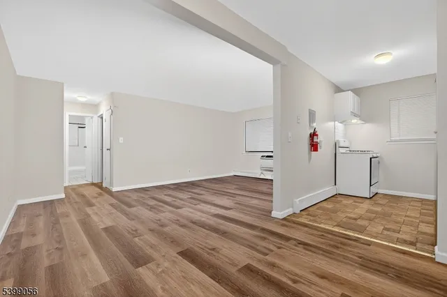a view of a room with a wooden floor