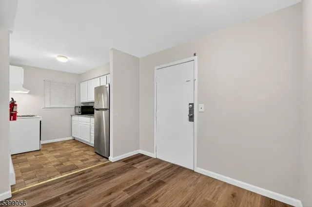 a view of kitchen with wooden floor