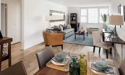 a living room with furniture and a window