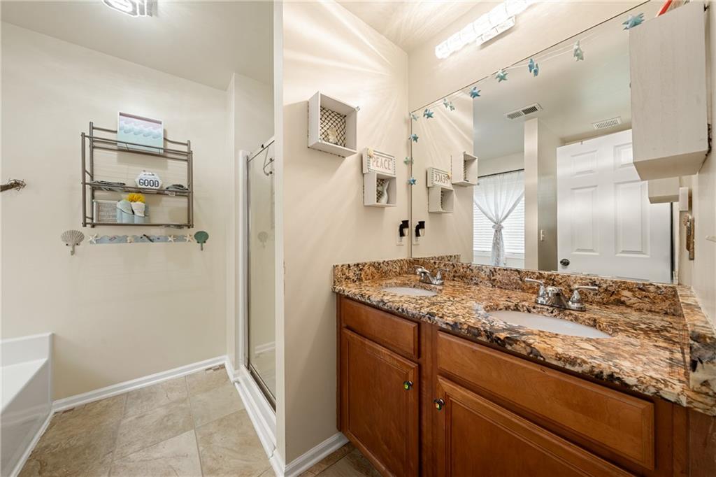 55 Meridian Point Dallas, GA 30132 - Photo 21 of 45 a bathroom with a granite countertop sink and a mirror